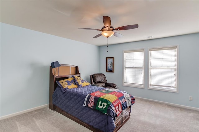 carpeted bedroom featuring ceiling fan