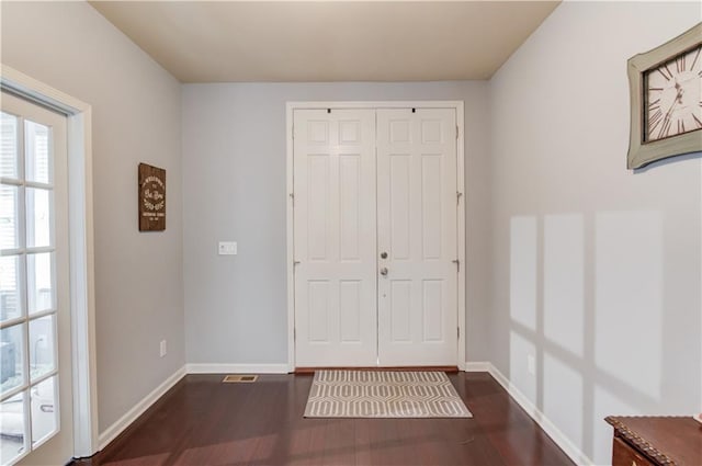 entrance foyer featuring dark hardwood / wood-style floors