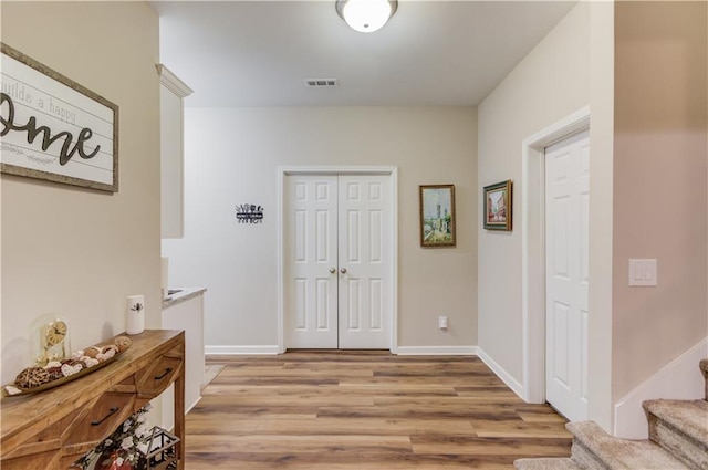 corridor featuring light hardwood / wood-style floors