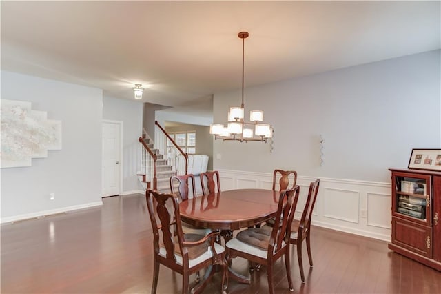 dining area featuring dark wood-type flooring