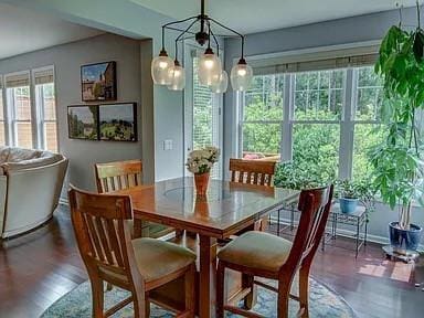 dining room with dark hardwood / wood-style flooring