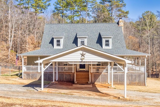 country-style home featuring a porch