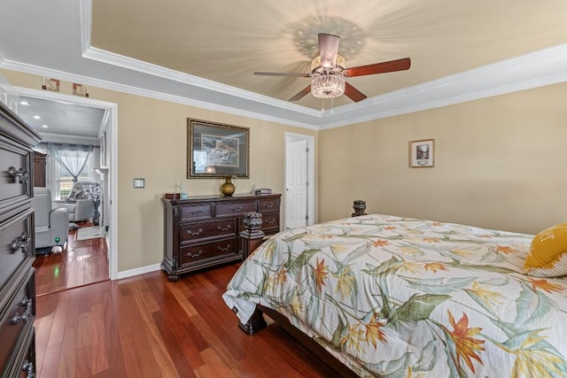 bedroom with baseboards, crown molding, a ceiling fan, and dark wood-type flooring