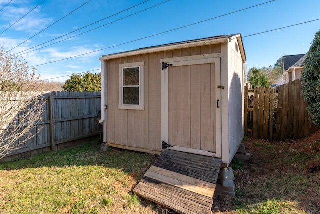 view of shed featuring a fenced backyard