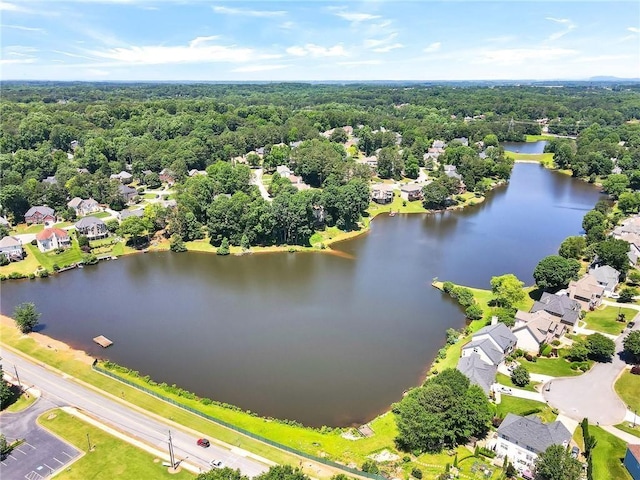 bird's eye view with a residential view, a water view, and a view of trees