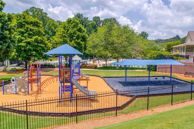 communal playground featuring fence