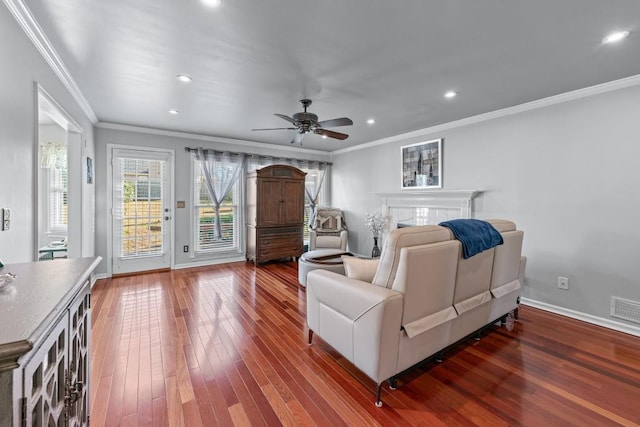 living room featuring recessed lighting, ornamental molding, a ceiling fan, baseboards, and hardwood / wood-style flooring