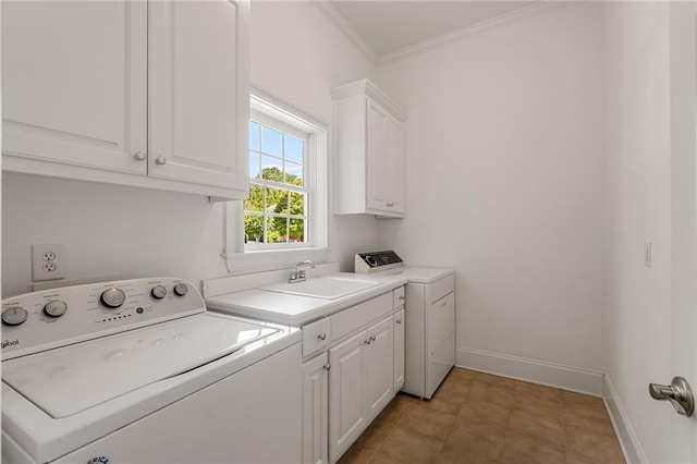 clothes washing area featuring cabinets, washing machine and dryer, light tile patterned floors, ornamental molding, and sink