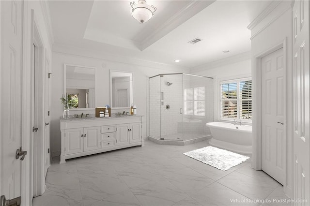 bathroom featuring vanity, shower with separate bathtub, a raised ceiling, and ornamental molding