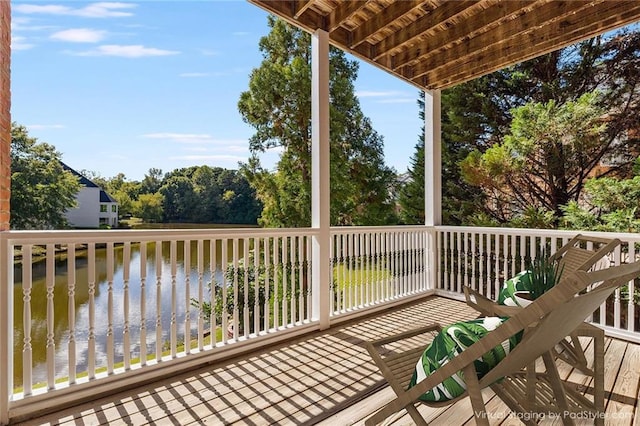 wooden deck with a water view