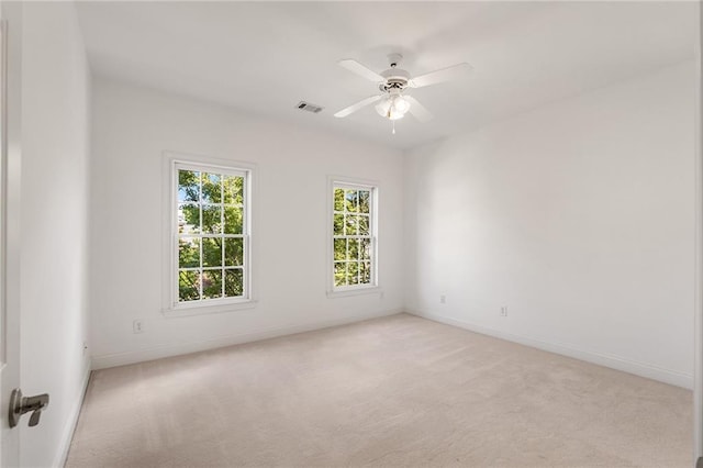 carpeted empty room with ceiling fan