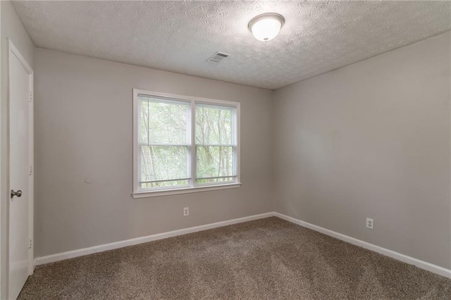10 Briarcliff Pl, Stockbridge, GA 30281 - carpeted empty room with a textured ceiling and baseboards