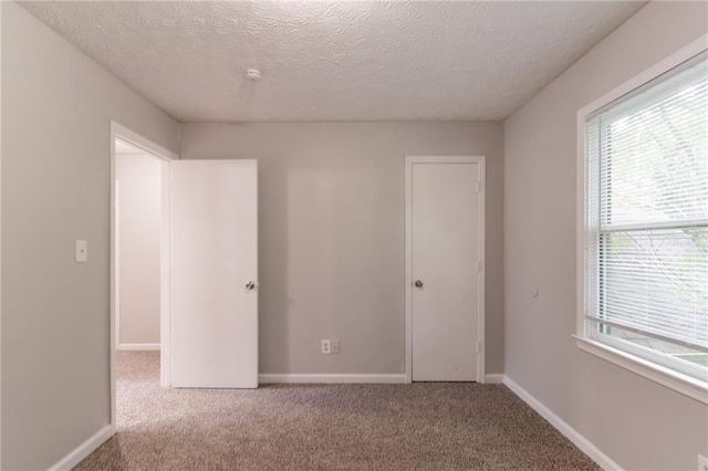 10 Briarcliff Pl, Stockbridge, GA 30281 - unfurnished bedroom featuring a textured ceiling and carpet floors