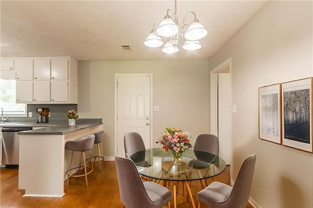 10 Briarcliff Pl, Stockbridge, GA 30281 - dining room featuring a chandelier and wood finished floors