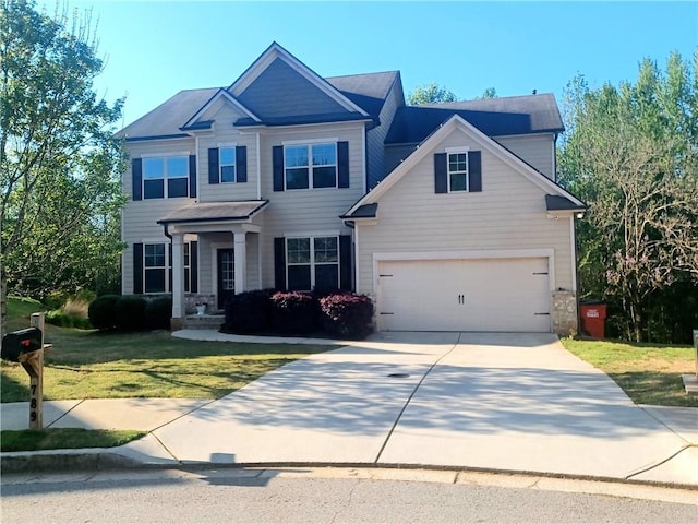 craftsman-style house with a garage and a front lawn