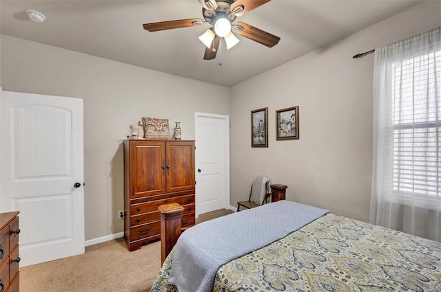 bedroom with light colored carpet and ceiling fan