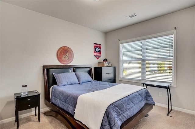 bedroom with light colored carpet