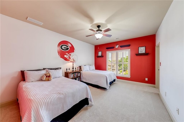 5925 Boulder Bluff Dr, Cumming, GA 30040 - bedroom featuring visible vents, light carpet, ceiling fan, connected bathroom, and a sink