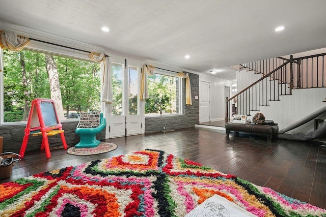 living room with ornamental molding, stairway, wood-type flooring, and recessed lighting