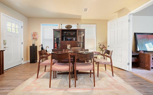 dining area with wood finished floors