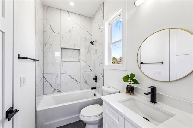 bathroom featuring toilet, washtub / shower combination, and vanity