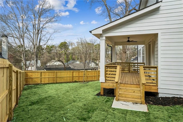 view of yard featuring a ceiling fan and a fenced backyard