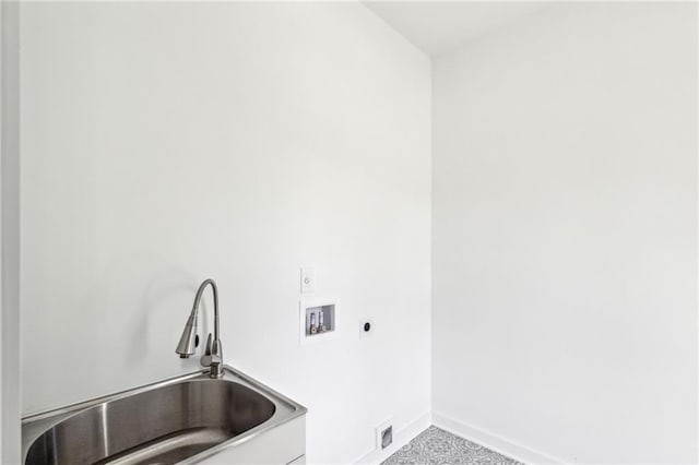 laundry area featuring hookup for a washing machine, hookup for an electric dryer, a sink, laundry area, and baseboards