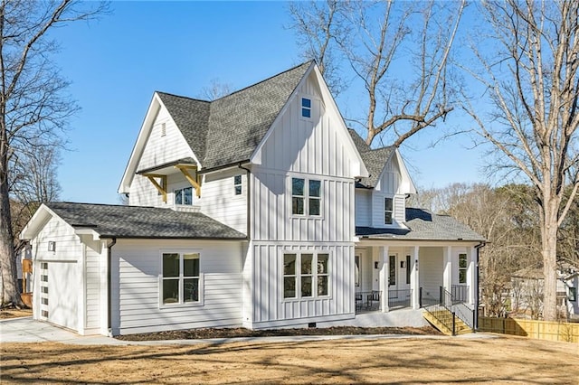 view of front of property with covered porch, an attached garage, board and batten siding, crawl space, and driveway