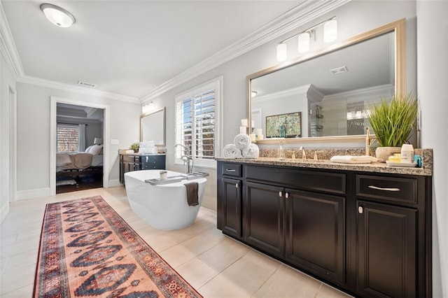 bathroom featuring tile patterned floors, vanity, crown molding, and a healthy amount of sunlight