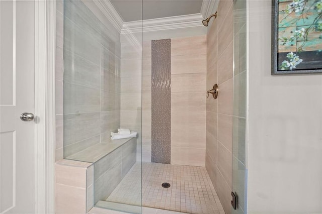 bathroom featuring an enclosed shower and ornamental molding