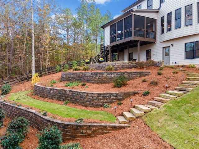 view of yard featuring a sunroom