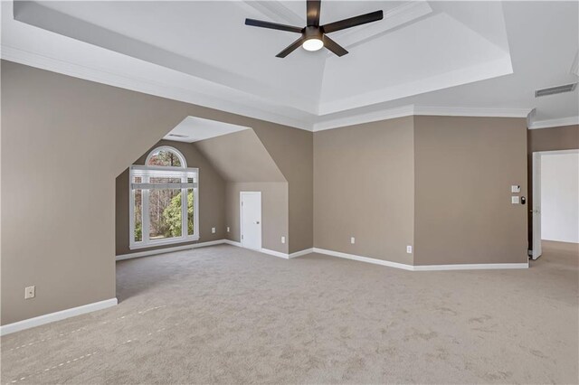 additional living space with ceiling fan, vaulted ceiling, and light carpet