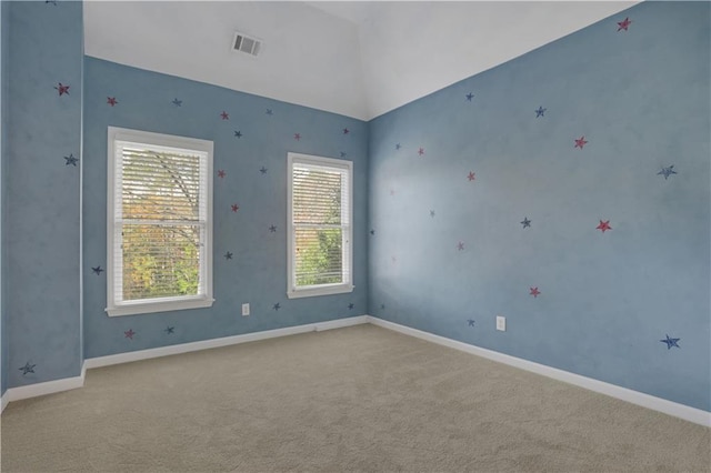 spare room with light carpet and a healthy amount of sunlight