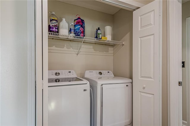 washroom featuring washer and dryer