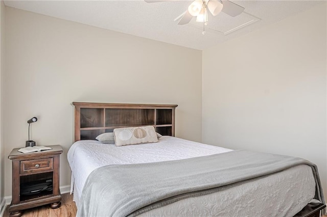 bedroom with wood finished floors and a ceiling fan
