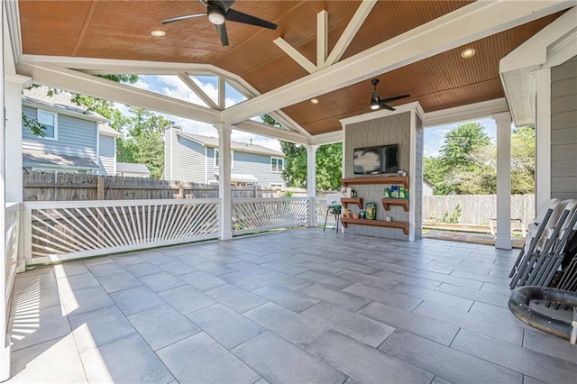 view of patio / terrace featuring ceiling fan and fence