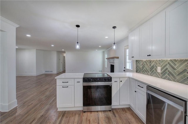 kitchen featuring tasteful backsplash, wine cooler, open floor plan, and electric range oven