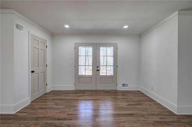 doorway to outside featuring recessed lighting, visible vents, ornamental molding, wood finished floors, and baseboards