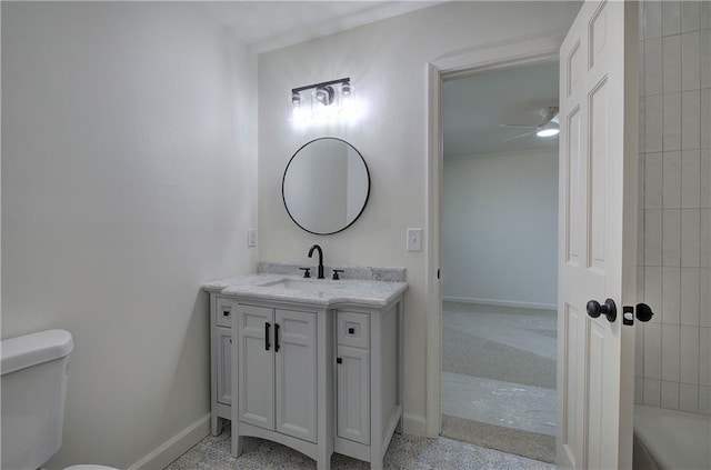 full bathroom featuring a ceiling fan, toilet, vanity, and baseboards