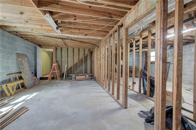 miscellaneous room featuring concrete block wall