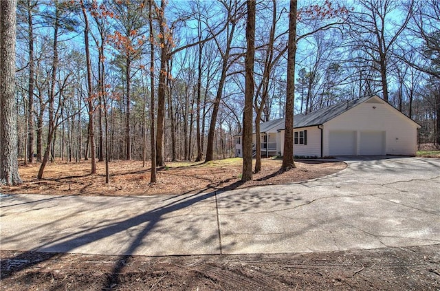 exterior space featuring driveway and an attached garage