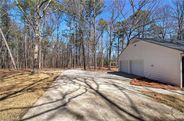 view of street with aphalt driveway