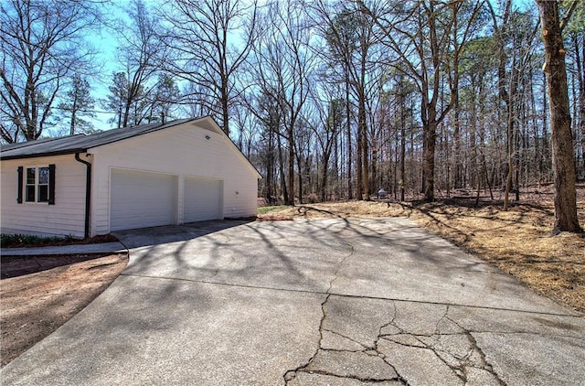 view of property exterior featuring a garage