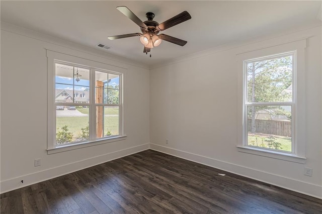 4075 O Henry Ct, Mcdonough, GA 30252 - spare room with plenty of natural light, baseboards, dark wood-type flooring, ceiling fan, and ornamental molding