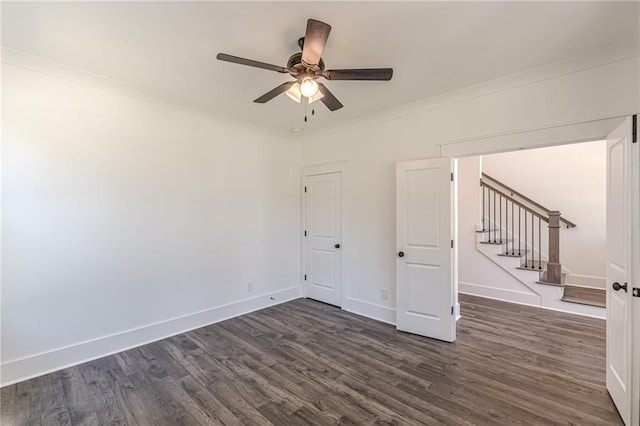 4075 O Henry Ct, Mcdonough, GA 30252 - unfurnished room with dark wood finished floors, stairway, ceiling fan, crown molding, and baseboards