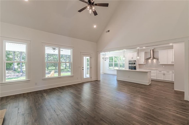 4075 O Henry Ct, Mcdonough, GA 30252 - unfurnished living room with ceiling fan, high vaulted ceiling, dark wood-style floors, recessed lighting, and baseboards