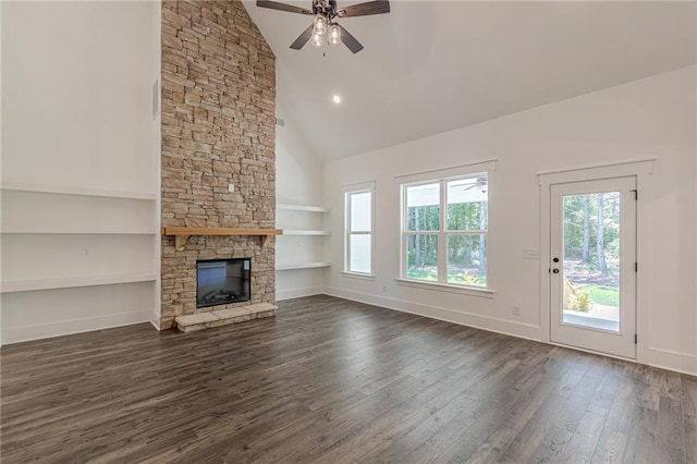 4075 O Henry Ct, Mcdonough, GA 30252 - unfurnished living room with built in features, dark wood-style flooring, ceiling fan, a fireplace, and high vaulted ceiling
