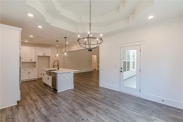 4075 O Henry Ct, Mcdonough, GA 30252 - kitchen with open floor plan, stainless steel dishwasher, a tray ceiling, a chandelier, and dark wood-style floors