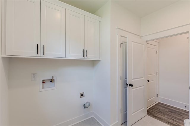 4075 O Henry Ct, Mcdonough, GA 30252 - washroom featuring hookup for an electric dryer, baseboards, cabinet space, and washer hookup