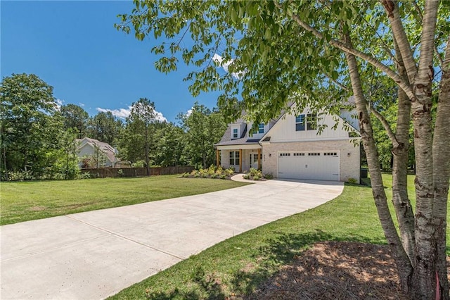 4075 O Henry Ct, Mcdonough, GA 30252 - view of front of house with driveway, brick siding, a garage, and board and batten siding